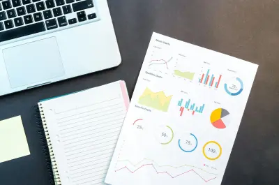 Analytics charts on a desk during publication review